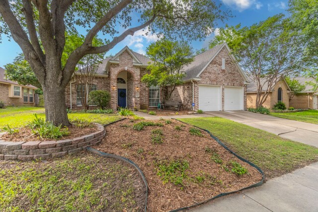 5428 Lake Powell Dr, Fort Worth, TX 76137 - traditional home featuring brick siding, an attached garage, driveway, and a shingled roof