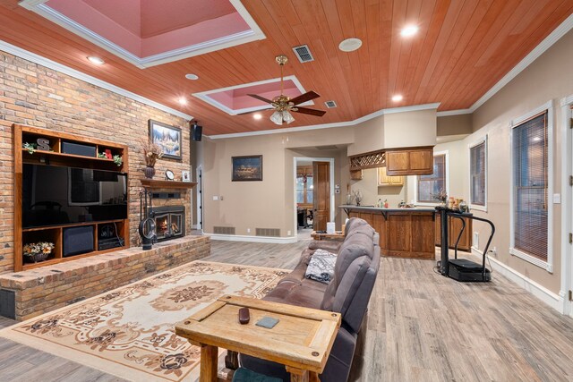 10080 Arvin Hill Rd, Aubrey, TX 76227 - living area featuring light wood-style floors, wood ceiling, a skylight, a ceiling fan, and baseboards