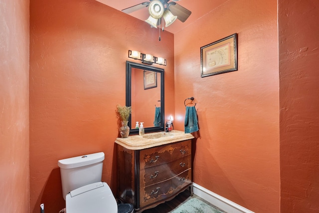 10080 Arvin Hill Rd, Aubrey, TX 76227 - half bathroom featuring ceiling fan, toilet, and vanity