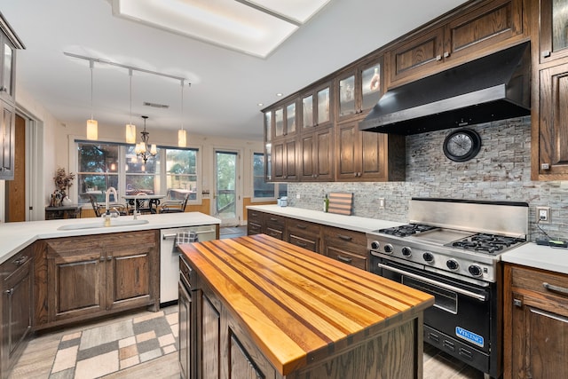10080 Arvin Hill Rd, Aubrey, TX 76227 - kitchen with a sink, stainless steel appliances, wooden counters, under cabinet range hood, and backsplash