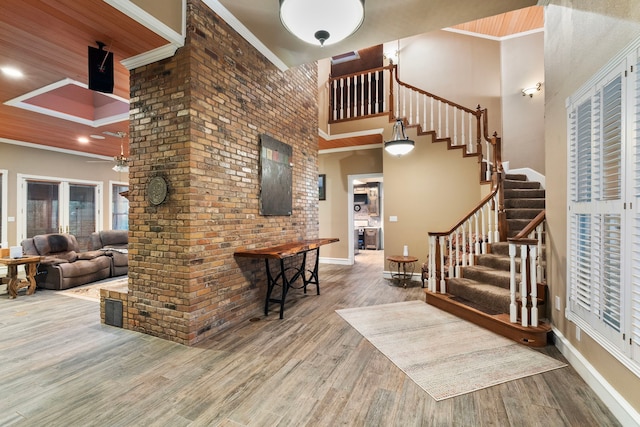 10080 Arvin Hill Rd, Aubrey, TX 76227 - entrance foyer featuring stairway, crown molding, a towering ceiling, wood finished floors, and a ceiling fan