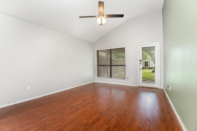 unfurnished living room featuring high vaulted ceiling, a ceiling fan, a fireplace, dark wood finished floors, and baseboards