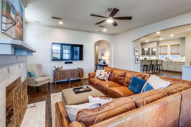 3728 Stanford Ave, University Park, TX 75225 - living area with arched walkways, ornamental molding, a fireplace, a ceiling fan, and recessed lighting