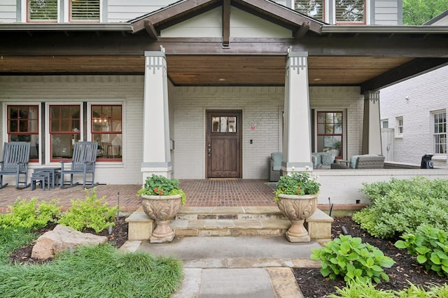 3728 Stanford Ave, University Park, TX 75225 - doorway to property featuring a porch and brick siding