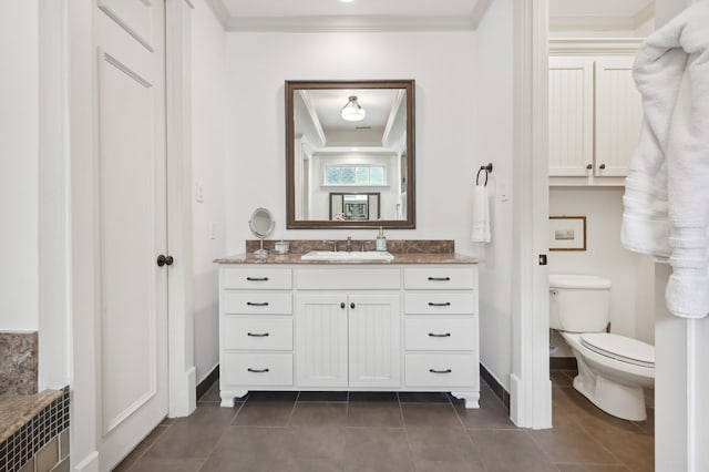3728 Stanford Ave, University Park, TX 75225 - bathroom featuring baseboards, ornamental molding, tile patterned floors, toilet, and vanity