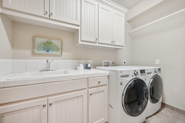 3728 Stanford Ave, University Park, TX 75225 - clothes washing area with cabinet space, independent washer and dryer, and baseboards
