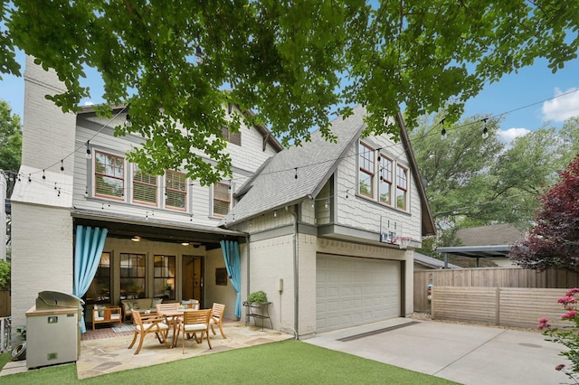 3728 Stanford Ave, University Park, TX 75225 - back of property with fence, a garage, a patio, concrete driveway, and a shingled roof