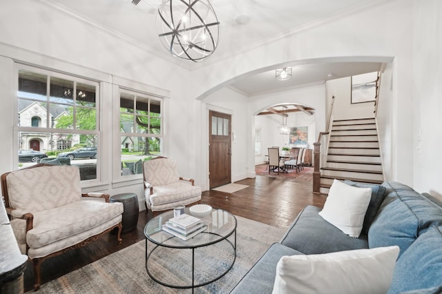 3728 Stanford Ave, University Park, TX 75225 - living room with arched walkways, crown molding, wood finished floors, stairs, and a chandelier