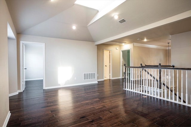 3704 Southport Dr, Plano, TX 75025 - spare room featuring baseboards, wood finished floors, lofted ceiling, and crown molding