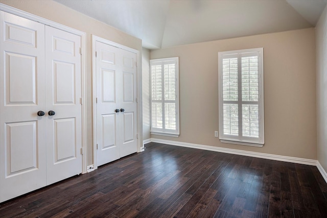3704 Southport Dr, Plano, TX 75025 - unfurnished bedroom with dark wood finished floors, baseboards, and lofted ceiling