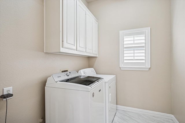 3704 Southport Dr, Plano, TX 75025 - washroom featuring independent washer and dryer, cabinet space, and baseboards