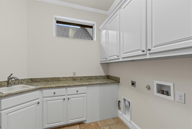 washroom with gas dryer hookup, hookup for an electric dryer, cabinet space, crown molding, and light stone finish floors