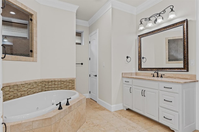 bathroom with a jetted tub, crown molding, vanity, and baseboards