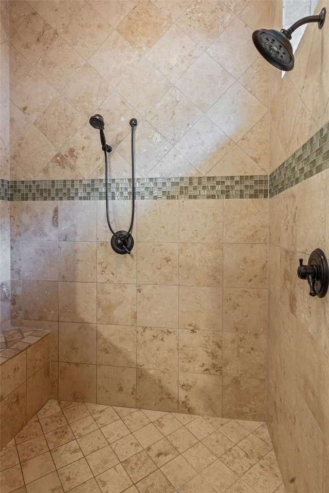 full bath with a tile shower