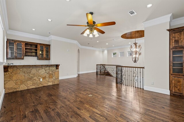 unfurnished living room with ceiling fan, arched walkways, wood finished floors, recessed lighting, and baseboards