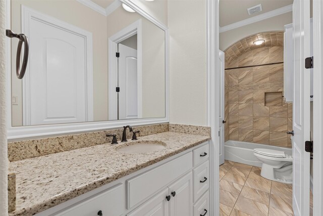 bathroom with ornamental molding, vanity, toilet, and bathtub / shower combination