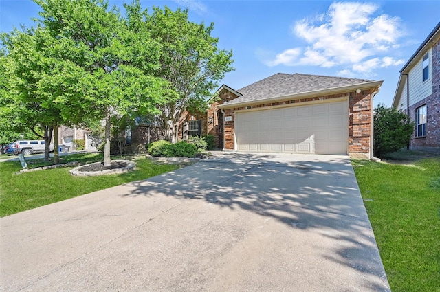 2691 Waterdance Dr, Little Elm, TX 75068 - view of front facade featuring driveway, a front lawn, an attached garage, roof with shingles, and brick siding