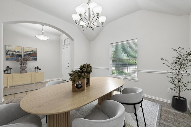 2691 Waterdance Dr, Little Elm, TX 75068 - dining space featuring arched walkways, vaulted ceiling, a chandelier, and baseboards