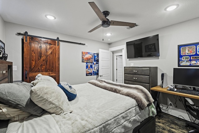 2512 Bennett Ave, Sherman, TX 75090 - bedroom featuring a barn door, a ceiling fan, and recessed lighting