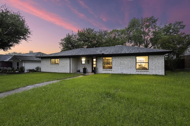 2512 Bennett Ave, Sherman, TX 75090 - ranch-style home featuring a lawn and brick siding