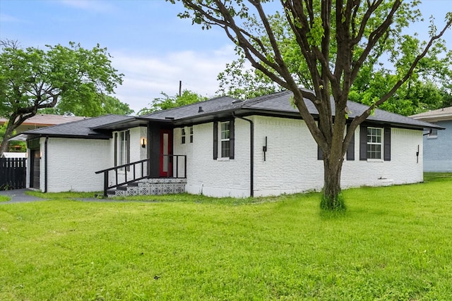ranch-style house featuring brick siding and a garage