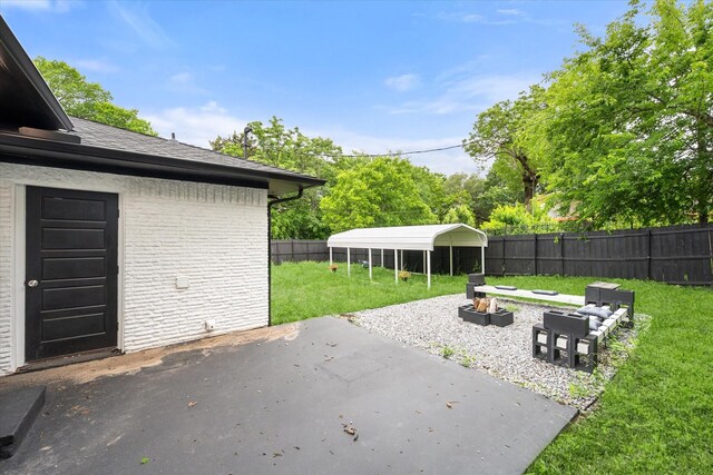 view of patio / terrace with a fire pit
