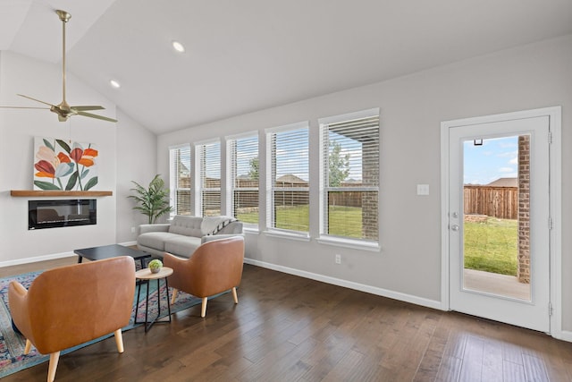 living area with baseboards, wood finished floors, vaulted ceiling, recessed lighting, and ceiling fan