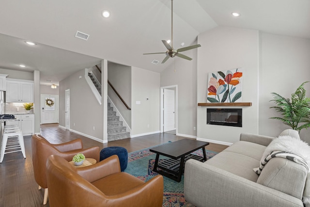 living room with a ceiling fan, stairs, dark wood-style floors, recessed lighting, and baseboards