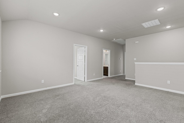 spare room with recessed lighting, carpet, baseboards, and lofted ceiling