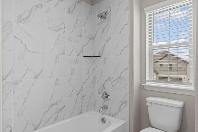 bathroom with shower / bathtub combination, plenty of natural light, and toilet