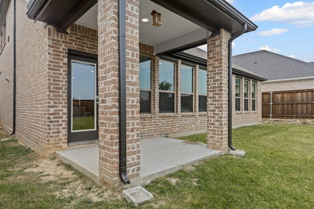doorway to property with brick siding