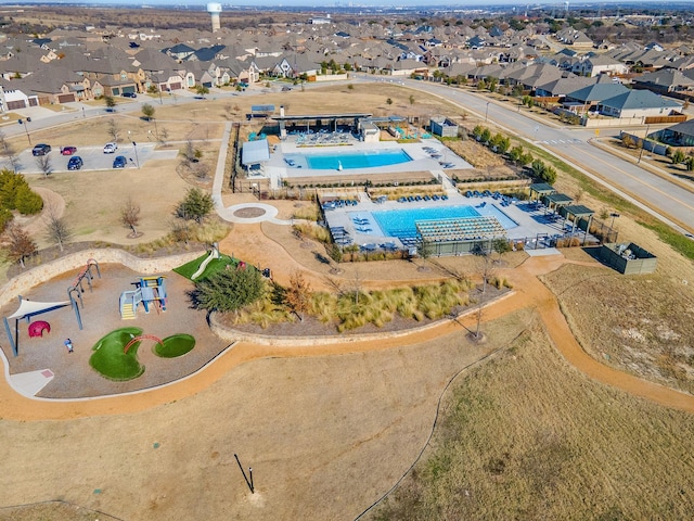 aerial view of residential area with a pool