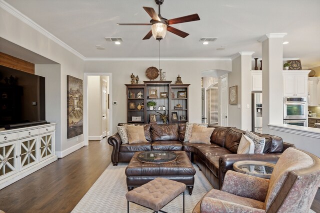 850 Long Valley Ct, Prosper, TX 75078 - living room featuring ceiling fan, arched walkways, dark wood finished floors, crown molding, and baseboards
