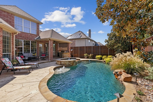 850 Long Valley Ct, Prosper, TX 75078 - view of swimming pool with a patio, a fenced backyard, a pool with connected hot tub, outdoor lounge area, and an outdoor kitchen