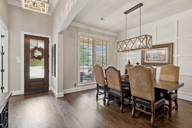 850 Long Valley Ct, Prosper, TX 75078 - dining area featuring dark wood-type flooring, crown molding, arched walkways, and baseboards