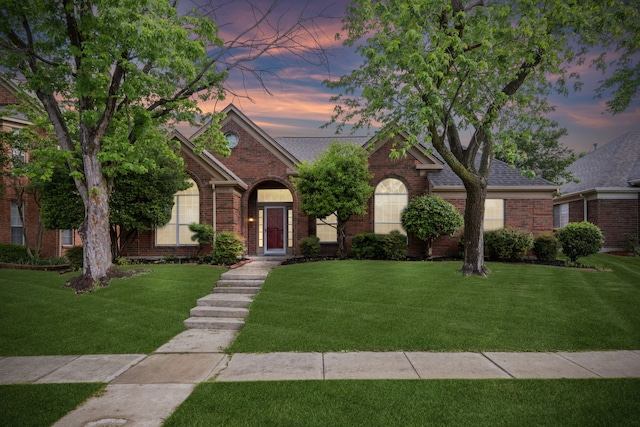 10008 Preston Vineyard Dr, Frisco, TX 75035 - view of front facade with brick siding, a front lawn, and roof with shingles