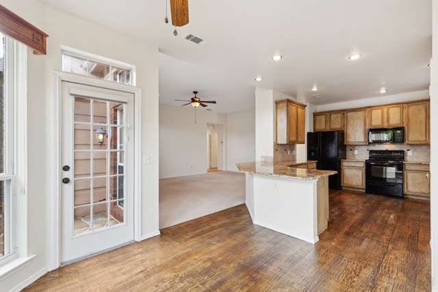 10008 Preston Vineyard Dr, Frisco, TX 75035 - kitchen with black appliances, a ceiling fan, a peninsula, decorative backsplash, and dark wood-style floors