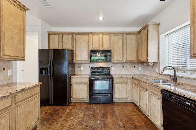 10008 Preston Vineyard Dr, Frisco, TX 75035 - kitchen featuring black appliances, a sink, light stone counters, dark wood-type flooring, and tasteful backsplash