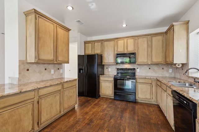10008 Preston Vineyard Dr, Frisco, TX 75035 - kitchen featuring black appliances, a sink, dark wood-type flooring, light stone countertops, and tasteful backsplash