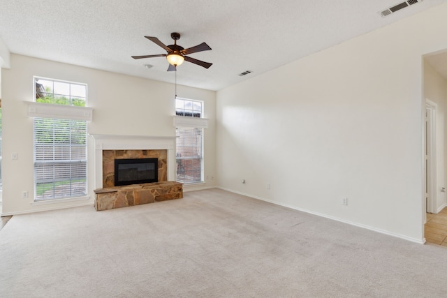 10008 Preston Vineyard Dr, Frisco, TX 75035 - unfurnished living room with a tile fireplace, carpet, ceiling fan, and baseboards
