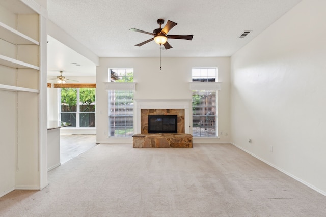 10008 Preston Vineyard Dr, Frisco, TX 75035 - unfurnished living room featuring a ceiling fan, carpet, healthy amount of natural light, and a textured ceiling
