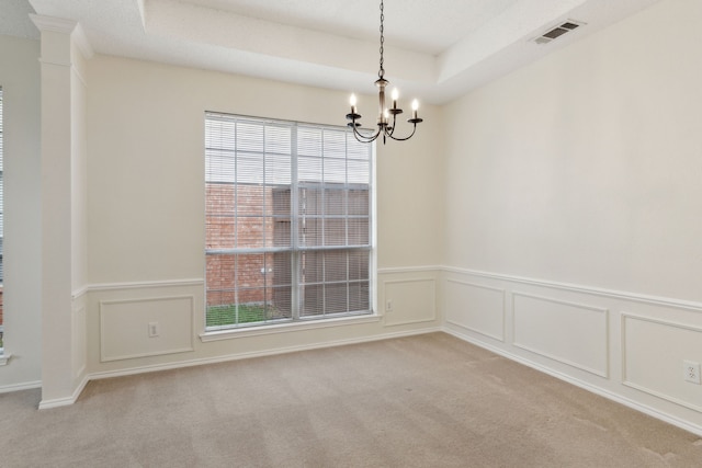 10008 Preston Vineyard Dr, Frisco, TX 75035 - spare room with light colored carpet, a chandelier, a wainscoted wall, and a decorative wall