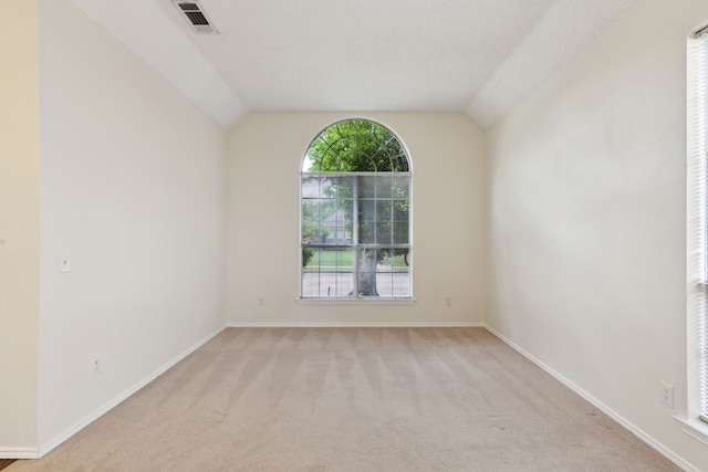 10008 Preston Vineyard Dr, Frisco, TX 75035 - empty room with light colored carpet, baseboards, and vaulted ceiling