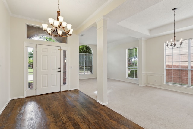 10008 Preston Vineyard Dr, Frisco, TX 75035 - entrance foyer with a chandelier, wood finished floors, ornate columns, crown molding, and baseboards