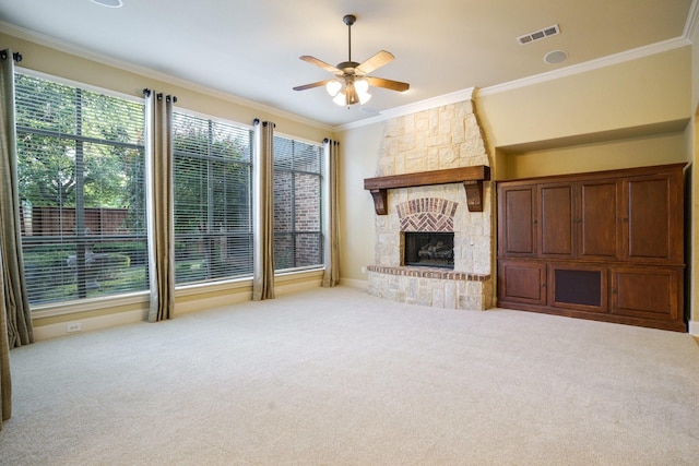 1727 Lantana Ln, Frisco, TX 75033 - unfurnished living room with carpet, a ceiling fan, crown molding, and a stone fireplace