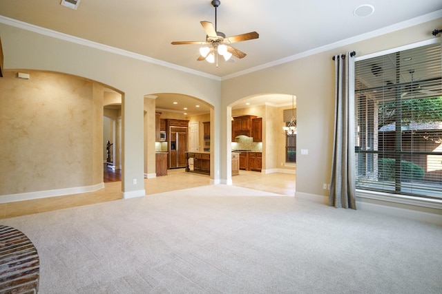 1727 Lantana Ln, Frisco, TX 75033 - unfurnished living room featuring light colored carpet, crown molding, ceiling fan, arched walkways, and baseboards