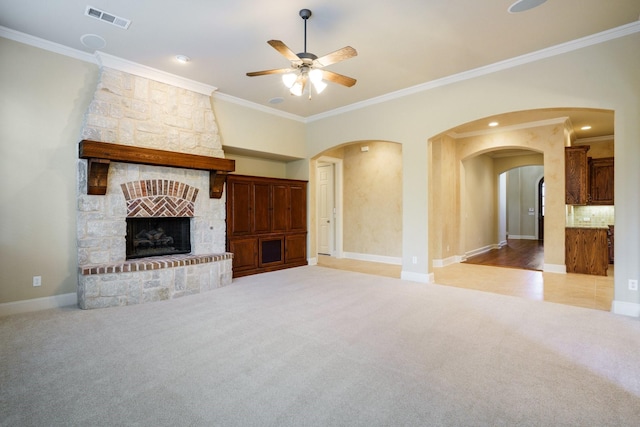 1727 Lantana Ln, Frisco, TX 75033 - unfurnished living room featuring carpet floors, arched walkways, a ceiling fan, crown molding, and baseboards