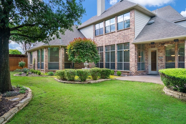 1727 Lantana Ln, Frisco, TX 75033 - back of house with brick siding, a chimney, a shingled roof, and a patio area