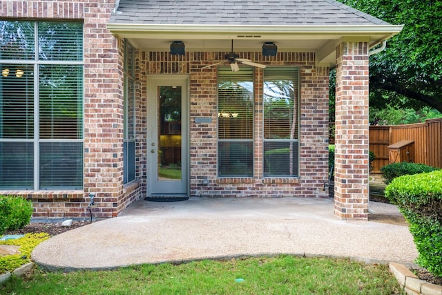 1727 Lantana Ln, Frisco, TX 75033 - property entrance with a shingled roof, brick siding, a patio, and fence
