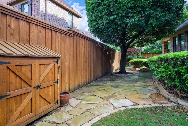 1727 Lantana Ln, Frisco, TX 75033 - view of property exterior featuring fence, brick siding, and a patio